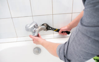 Plumber uninstalling faucet